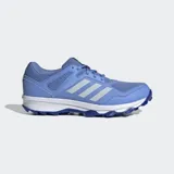Championes de hockey Adidas Fabela Rise, color azul con las icónicas tres tiras en tono más claro. Presentan un diseño de malla transpirable con refuerzos sintéticos, mediasuela de EVA para amortiguación y suela Traxion con tapones para un agarre superior en la cancha.