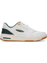 Championes Under Armour modelo Flex, de diseño urbano en color blanco con detalles en verde oscuro, amarillo y suela color caramelo. Confeccionados en cuero premium con entresuela de EVA para mayor amortiguación.