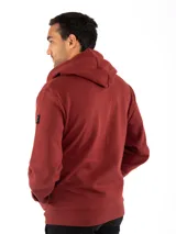 Campera canguro Kevingston de jersey frisado invisible de algodón, en color azul. Presenta cierre frontal completo, capucha con cordón ajustable y bolsillos delanteros amplios tipo canguro.