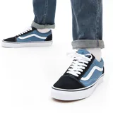 Championes Vans modelo Old Skool, con diseño clásico de caña baja, confeccionados en lona azul y gamuza en puntera y talón, con la icónica banda lateral blanca y suela de goma vulcanizada.