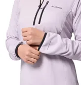 Buzo tipo polar de mujer con cierre de media cremallera, cuello alto y bolsillo frontal con cierre en el pecho. Presenta tecnología de absorción de humedad y ribetes en puños y cuello.