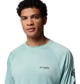 Remera deportiva de manga larga Columbia Terminal Tackle, color verde menta, con tecnología Omni-Shade y Omni-Wick. Presenta mangas raglán y logo de la marca estampado en el pecho y en la manga izquierda.