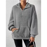 Buzo de polar con textura suave, color beige, con cuello alto y cierre frontal parcial. Diseño de manga larga y calce holgado.