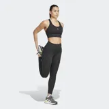 Calza deportiva Adidas de running, color negro, con cintura alta, largo 7/8 y logo de la marca en la pierna izquierda.