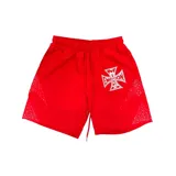 Short de nylon rojo con cordón ajustable en la cintura, estampa de cruz con diseño tipográfico en la pierna izquierda y detalles de puntos brillantes en los laterales.