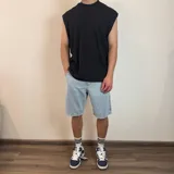 Musculosa color crema de micro panal con cuello alto.