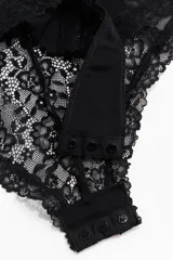 Body colaless negro confeccionado en encaje y malla transparente, con soutien push-up, copas acolchadas con aros y breteles regulables.