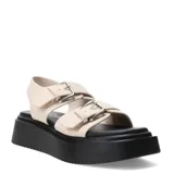 Sandalias Miss Carol modelo Mariva, color beige con doble tira ajustable con hebillas metálicas plateadas y plataforma negra.