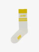 Medias deportivas de algodón color blanco con detalles en amarillo, con logo de la marca Autry.