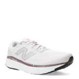 Championes de running New Balance modelo Evoz V4, color blanco con detalles en gris y toques de color salmón. Presentan tecnología Fresh Foam X en la entresuela para una amortiguación superior, parte superior de malla técnica transpirable y suela de goma duradera.