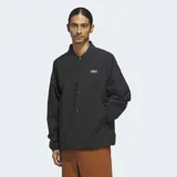 Campera tipo coach de la marca Adidas, color negro, con cuello camisero, cierre frontal de botones a presión y bolsillos laterales. Presenta un pequeño logo bordado en el pecho.