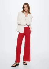 Pantalon de punto fino mezcla de lino, color rojo, con diseño recto de tiro alto, cintura elástica y aberturas laterales en el bajo.