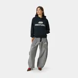 Hoodie oversize color negro de algodón, con capucha, bolsillo frontal tipo canguro y estampado frontal con el texto y logotipo de EM ESTUDIOS.