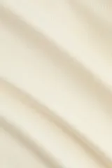 Top de punto fino color beige, sin mangas, con escote redondo, pliegues en los hombros y remate acanalado en el bajo.