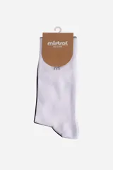 Media larga de algodón marca Mistral, con diseño combinado en colores blanco y negro y logo bordado en la parte superior.