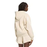 Canguro Adidas de mujer, modelo Kit 3 Stripes, en color beige. Presenta capucha, bolsillo frontal tipo canguro, mangas largas con las icónicas tres tiras blancas y el logo de la marca bordado en el centro del pecho.