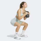 Calza corta deportiva Adidas de tiro alto, con ajuste ceñido y bolsillo lateral en el muslo. Confeccionada con tecnología AEROREADY de absorción de humedad.