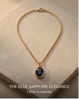 Collar de bronce con cadena fina dorada y dije colgante ovalado con piedra azul oscura.