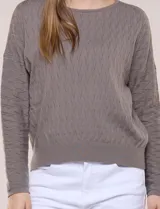 Buzo de punto calado en hilado fino marca Allie Rose, color gris, con escote redondo amplio, mangas largas de hombro caído y puños y ruedo acanalados.