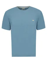 Remera de manga corta y cuello redondo, confeccionada en algodón orgánico. Presenta un diseño liso en color azul con el logo de la marca bordado en contraste en el pecho.