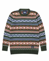 Buzo tejido de punto con diseño de patrones geométricos y rombos en tonos verde, naranja, blanco y azul. Presenta cuello redondo, puños y ruedo acanalados, con etiqueta de marca en el pecho.