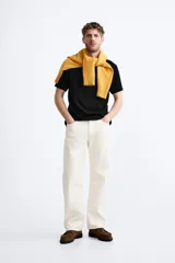 Jersey de algodón de punto, color rosa pálido, con cuello redondo y manga corta, corte relajado.