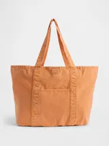 Bolso tote Gap color naranja tangerine, confeccionado en lona con doble asa de hombro, bolsillo frontal abierto y logo de la marca bordado.