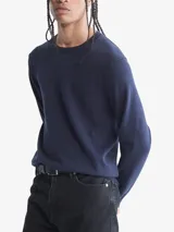 Sweater azul marino de algodón con cuello redondo y logo CK bordado en el pecho.