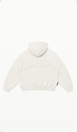 Buzo con capucha de color off-white, con diseño de letras en relieve en la espalda que forman la palabra 'littlestars'. Presenta puños y ruedo acanalados.