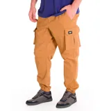 Pantalón cargo color marrón claro, marca Cat, modelo Diesel. Confeccionado en mezcla de algodón y spandex, con cintura elástica ajustable con cordón, bolsillos laterales tipo cargo, bolsillo trasero para herramientas y puños elásticos.