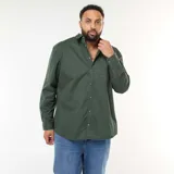 Sobrecamisa de algodón en color verde oscuro, con cierre frontal de botones, cuello clásico y un bolsillo aplicado en el pecho.