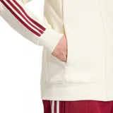 Campera deportiva Adidas de la selección de España, modelo alternativo, en color blanco marfil con cuello y detalles en bordó, con las clásicas tres tiras en las mangas y el escudo de la selección en el pecho.