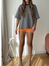 Short de baño color naranja, modelo shortcito con forro.