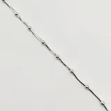 Pulsera semirrígida de plata 925, compuesta por una cadena fina con pequeñas esferas intercaladas a lo largo de toda la pieza.