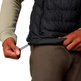 Chaleco acolchado negro con cierre frontal, cuello alto y logo de la marca bordado en el pecho. Cuenta con tecnología térmica reflectante y acabado resistente al agua.