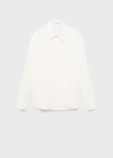 Camisa de lyocell color blanco, con cuello camisero, manga larga con puños abotonados, diseño recto y cierre frontal con botones ocultos.