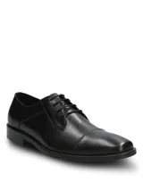 Zapato de vestir formal Hush Puppies modelo Jazz Black, confeccionado en cuero negro con diseño clásico acordonado y costura en la puntera.