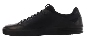 Zapatillas urbanas de caña baja, color blanco hueso, con suela gruesa de goma. Presentan detalles de perforaciones en el lateral y un pequeño tirador naranja en el talón.