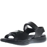 Sandalias de cuero color marrón con ajuste de velcro en el empeine y el talón. Presentan una suela de goma ergonómica en tono gris y logo de la marca grabado en la tira superior.