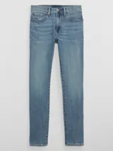 Jean de corte skinny confeccionado en denim elástico de lavado medio, con cierre de botón y cremallera, y diseño de cinco bolsillos.