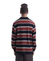 Camisa tipo rugby de manga larga Carhartt, con diseño a rayas horizontales en tonos bordó, negro y blanco. Presenta cuello tipo polo en color negro con cierre de botones y puños elásticos.