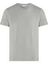 Remera manga corta color beige, corte regular y cuello redondo.