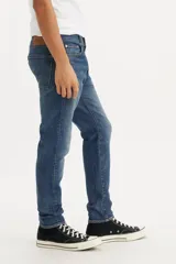 Jean de corte skinny color azul, tiro alto, confeccionado en tejido stretch.