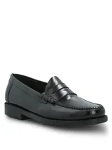 Mocasines tipo slip-on de cuero negro con acabado brillante, diseño clásico con banda frontal y suela de poliuretano con tecnología Bounce para mayor confort y absorción de impactos.
