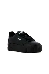 Championes de plataforma Puma modelo Karmen II Idol, con diseño en blanco, negro y franja lateral celeste.