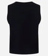 Chaleco Marfinno de corte recto y largo, confeccionado en tricot. Presenta cuello en V, cierre frontal con botones y diseño liso sin estampados.