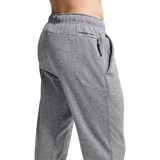 Pantalón de jogging Nike Therma, color gris jaspeado, con cintura elástica, bolsillos laterales y puños acanalados en los tobillos. Presenta el logo de la marca bordado en la parte superior.