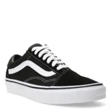 Championes Vans modelo Old Skool, de diseño clásico urbano. Presentan una combinación de lona y gamuza en color negro, con la icónica banda lateral blanca en contraste. Cuentan con suela de goma tipo waffle, punteras reforzadas y cuello acolchado para mayor comodidad.