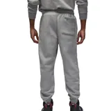 Pantalón de jogging Jordan Essential color gris melange, con cintura elástica ajustable mediante cordón, bolsillos laterales y puños elásticos en los tobillos. Presenta el logo Jumpman bordado en la parte superior izquierda.
