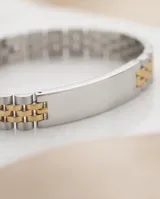 Pulsera de eslabones tipo reloj con placa central lisa para grabar, combinando tonos plateado y dorado.